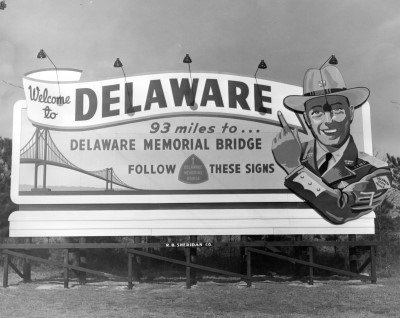 Billboard welcoming drivers to Delaware, specifying that the Delaware Memorial Bridge is 93 miles ahead